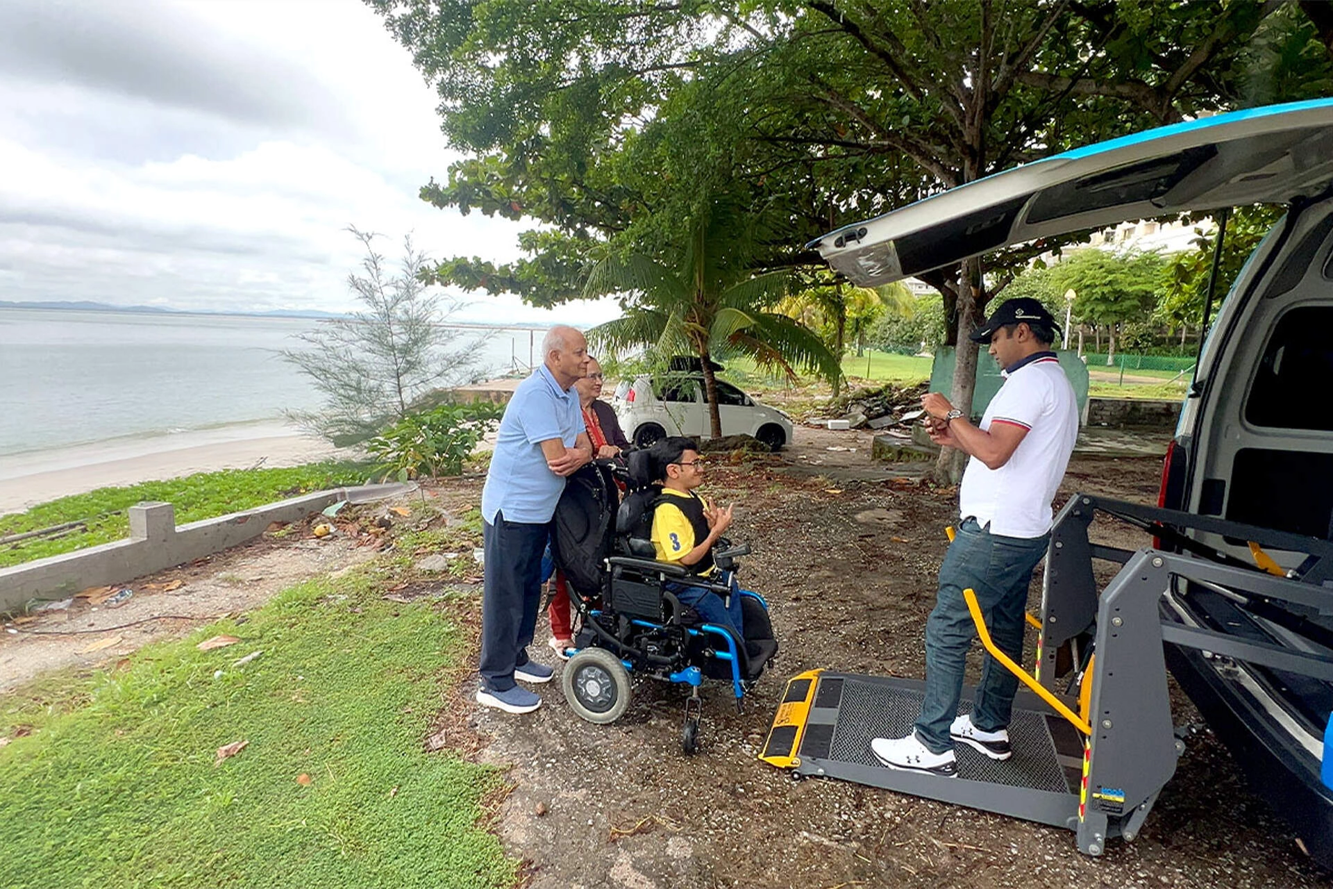 Wheelchair passenger enjoying an outdoor trip with Multicare transport support